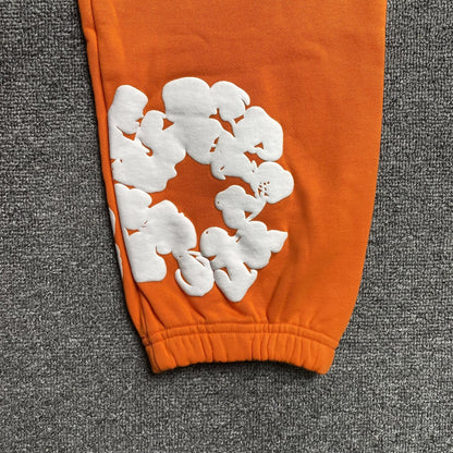DENIM TEARS COTTON WREATH SWEATPANTS ORANGE - netstar